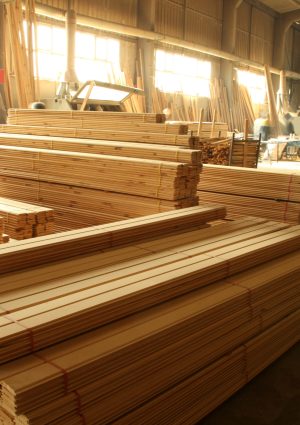 Wood timber construction material. Pile of construction timber at the construction site