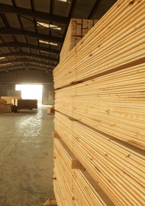 Wood timber construction material. Pile of construction timber at the construction site